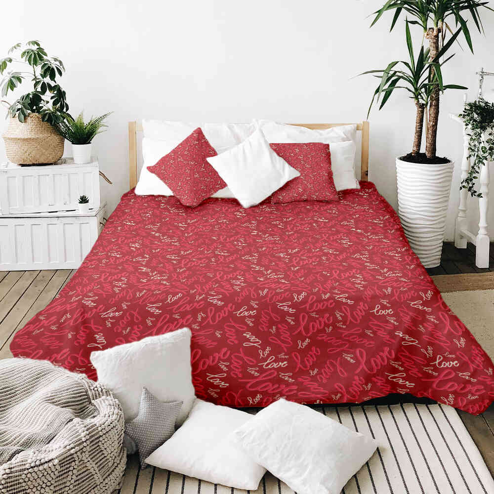 Housse à motifs pour couverture lestée, motif Aimer, sur un lit