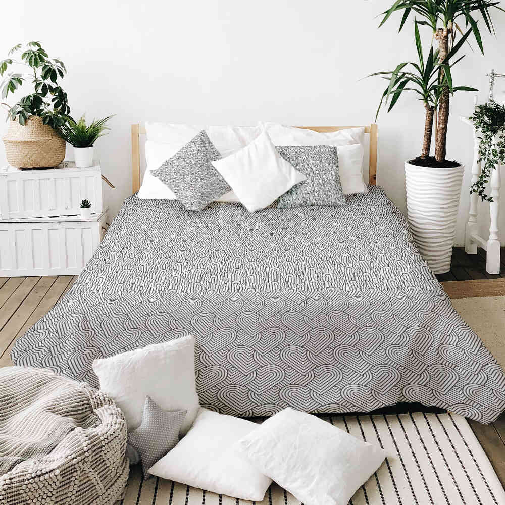 Housse à motifs pour couverture lestée, motif Coeur 2, sur un lit