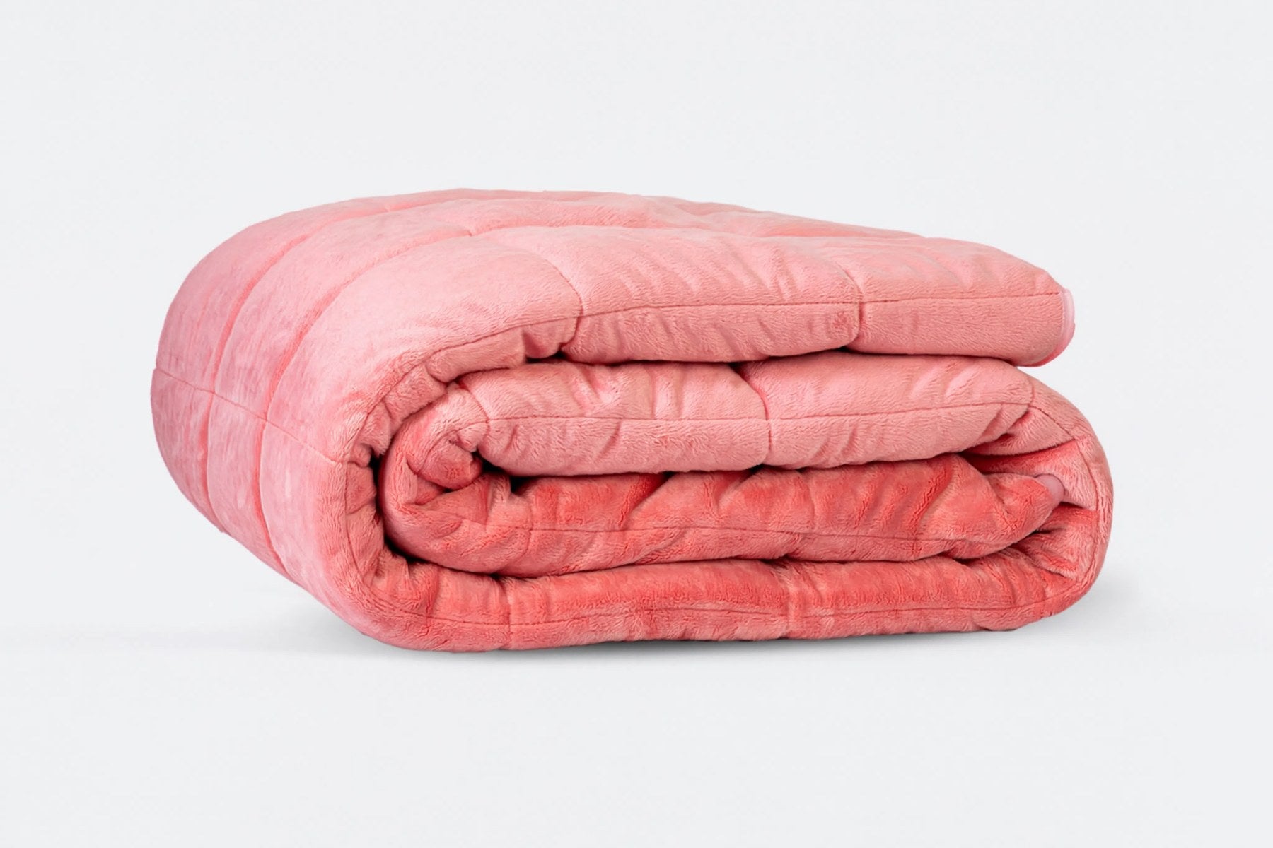 Couverture lestee en peluche corail pliee