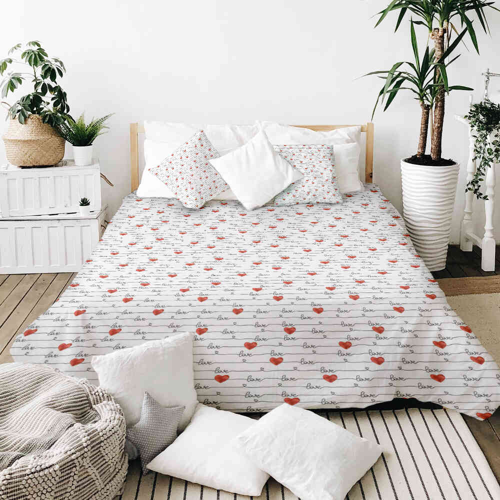 Housse à motifs pour couverture lestée, motif Écrivez, sur un lit
