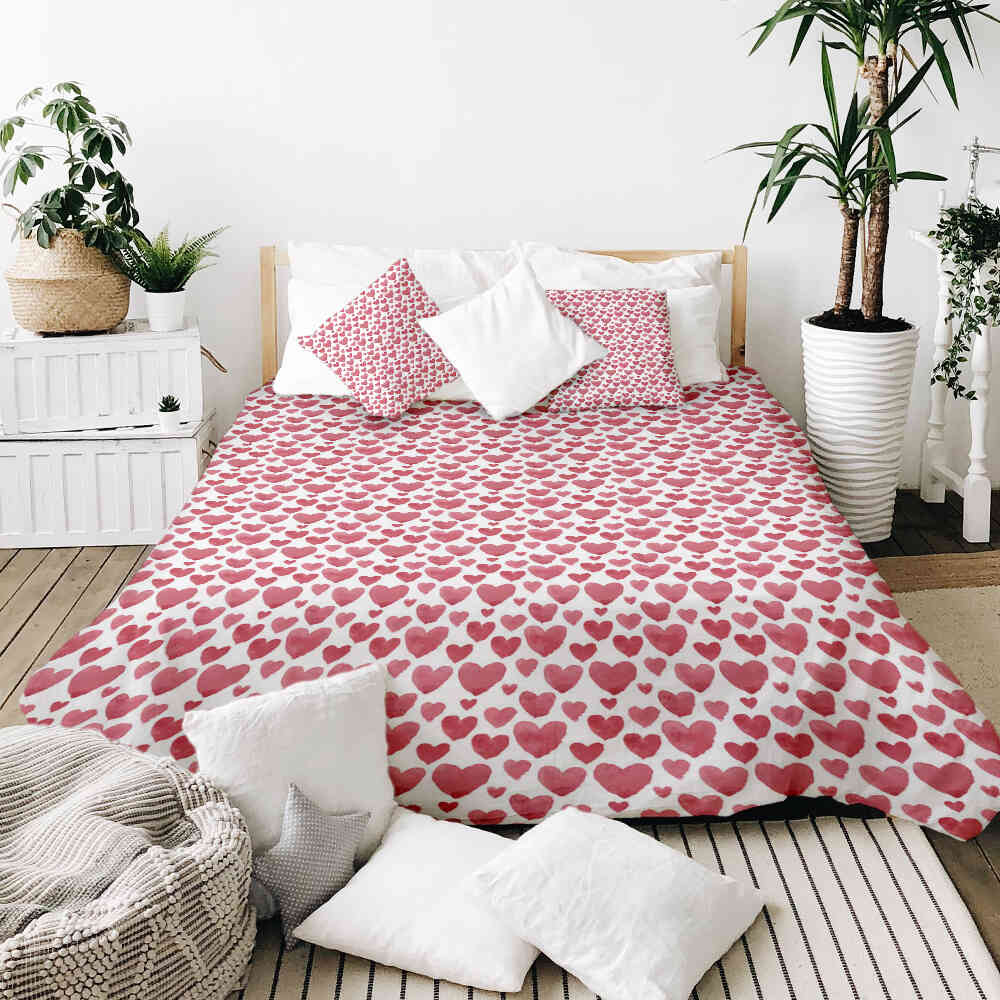 Housse à motifs pour couverture lestée, motif La Saint-Valentin, sur un lit