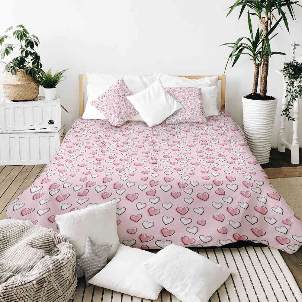 Housse à motifs pour couverture lestée, motif Coeur rose, sur un lit