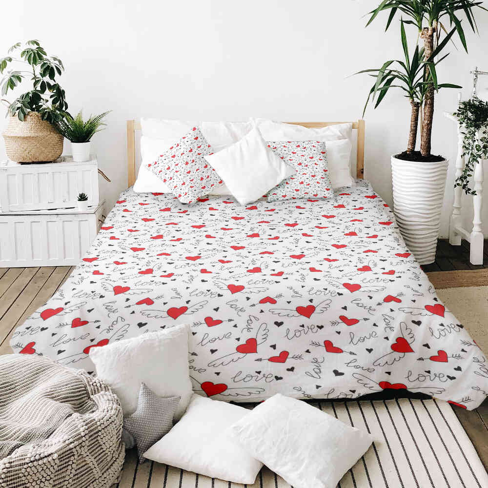 Housse à motifs pour couverture lestée, motif Ailes, sur un lit