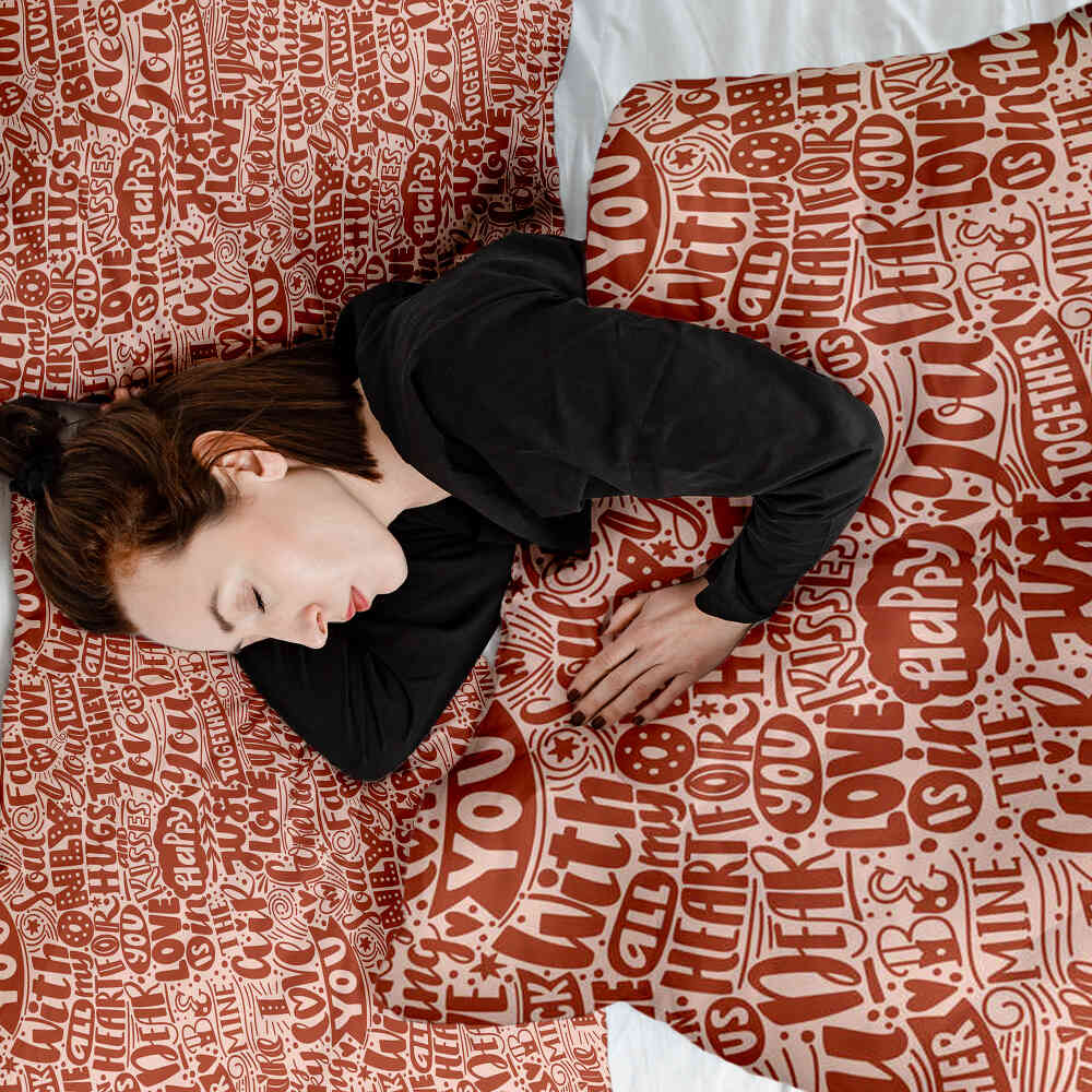 Housse à motifs pour couverture lestée, motif Papier, sur un lit