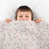 Housse à motifs pour couverture lestée enfant, imprimé Roses, tenue par un enfant #Motif_Roses