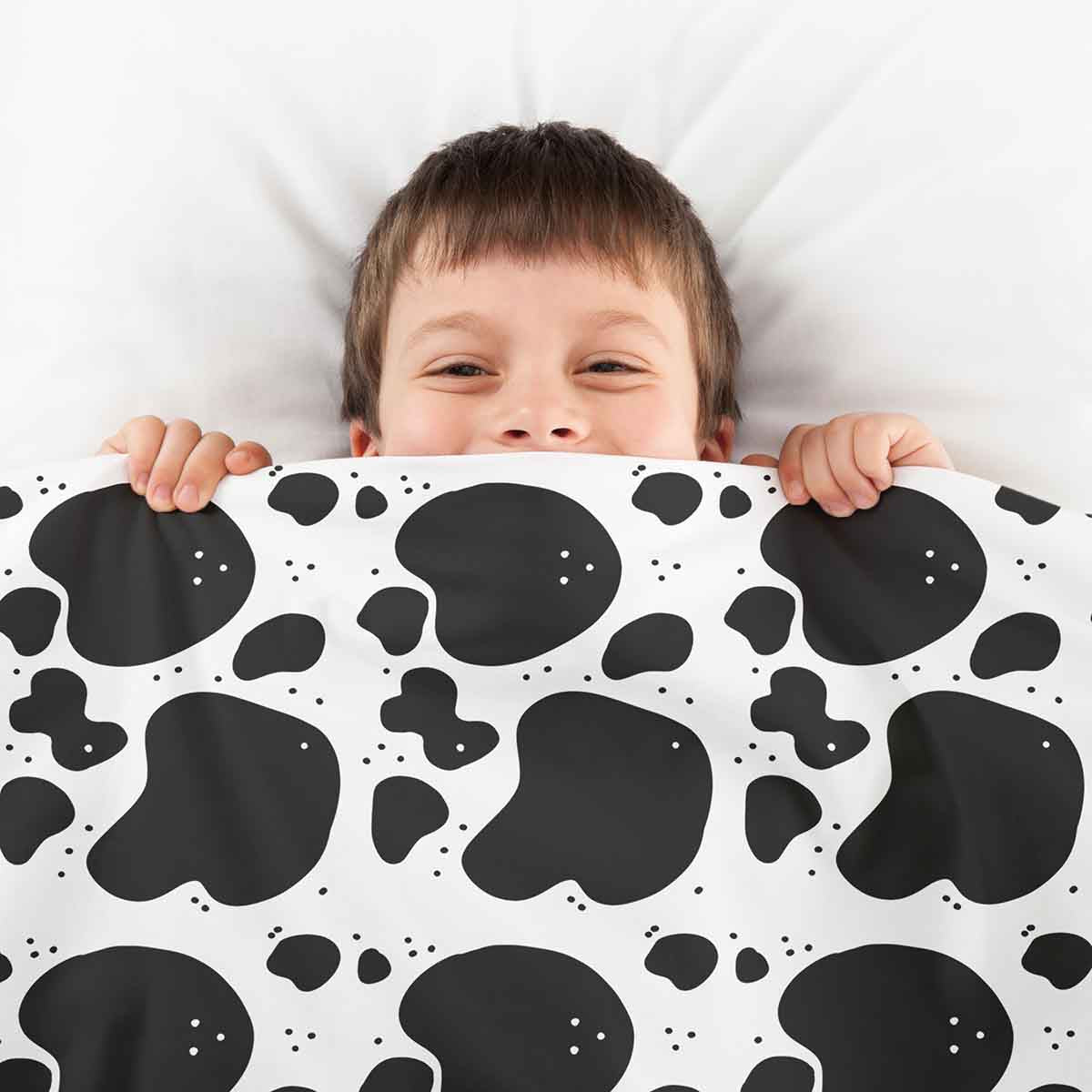 Housse à motifs pour couverture lestée enfant, imprimé Vachette, tenue par un enfant